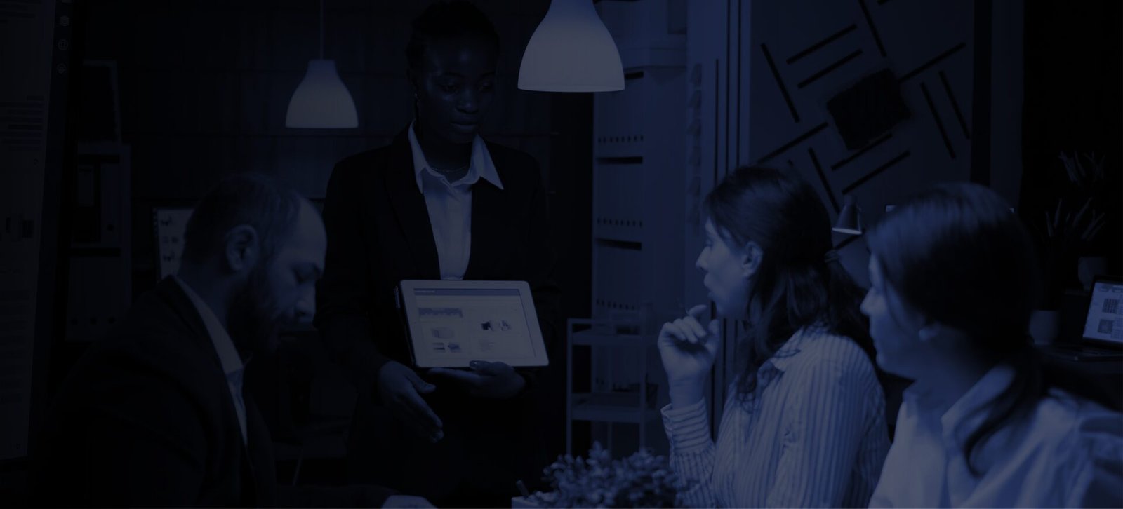 Business professional reviewing financial performance charts on a computer, representing LionTrust business development services.