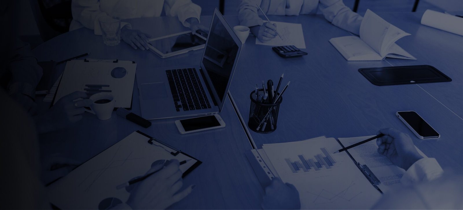 Professional presenting business information to colleagues in a meeting, representing strategic business development.