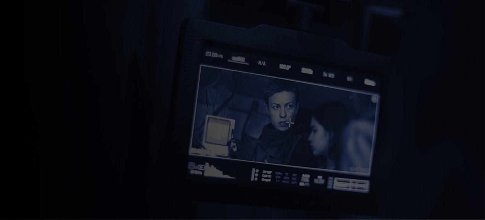 Film slate being prepared on set, representing LionTrust feature film and television investments.