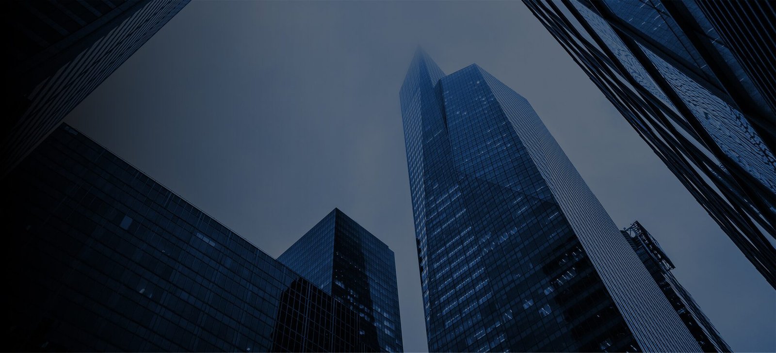 Modern financial district with illuminated growth bars, representing private investment and business expansion.